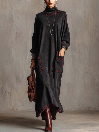 Estela | Vestido largo de ante sintético negro con pespuntes en contraste rojo y bolsillos de parche